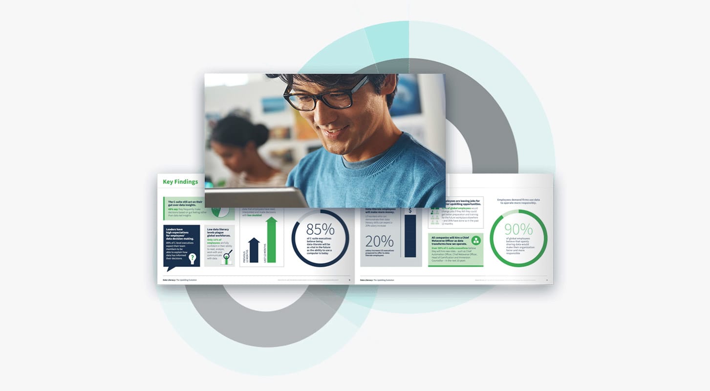 A person in glasses and a blue shirt smiles at a booklet displaying various graphs, charts, and percentages related to research findings. The background features overlapping circle graphics.